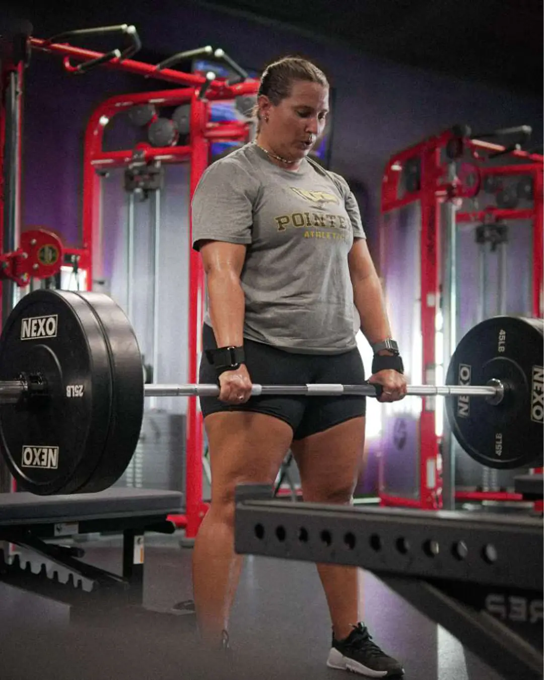 Lower body strength training - woman performing deadlift with proper form and technique at Galaxy Fit Lab Naples